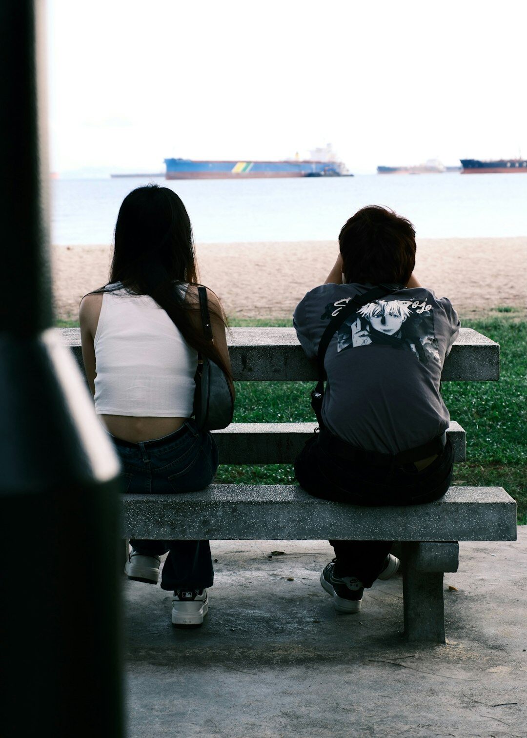 two friends talking on bench