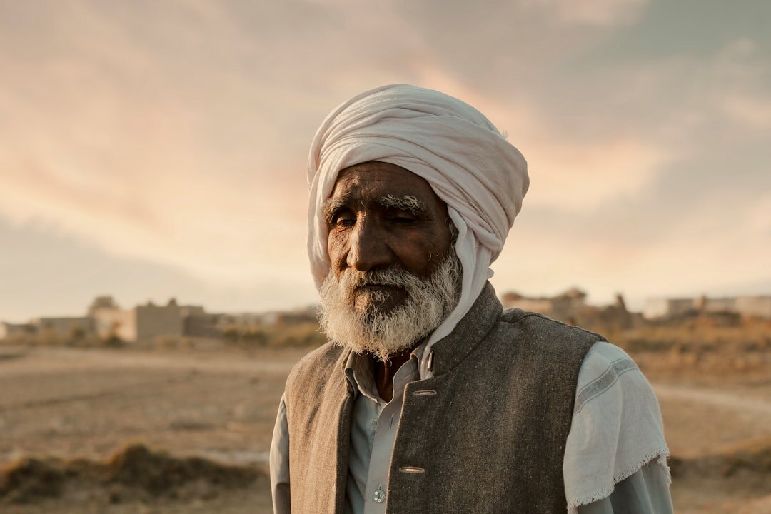 elderly man telling story in village